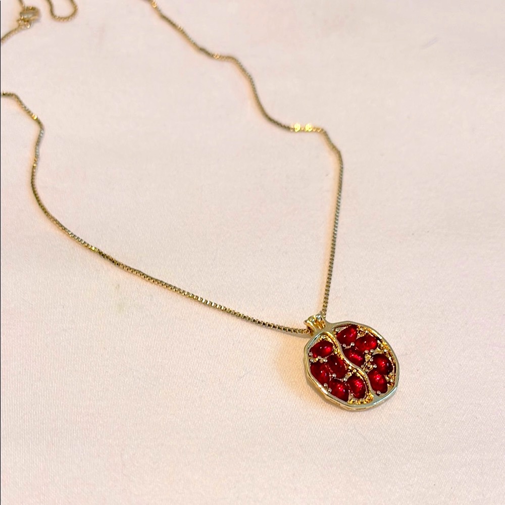 Pomegranate pendant necklace on gold box chain